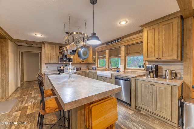 kitchen with a center island, dark wood-type flooring, a textured ceiling, and appliances with stainless steel finishes