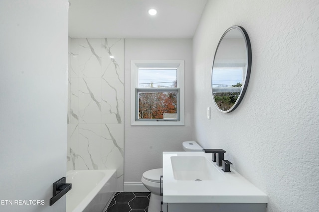 full bathroom featuring tile patterned floors, vanity, toilet, and tiled shower / bath combo