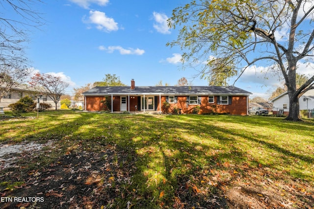 back of house featuring a yard