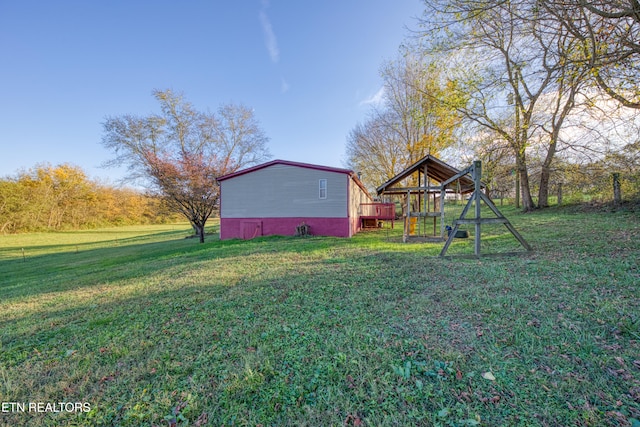 view of yard featuring a wooden deck