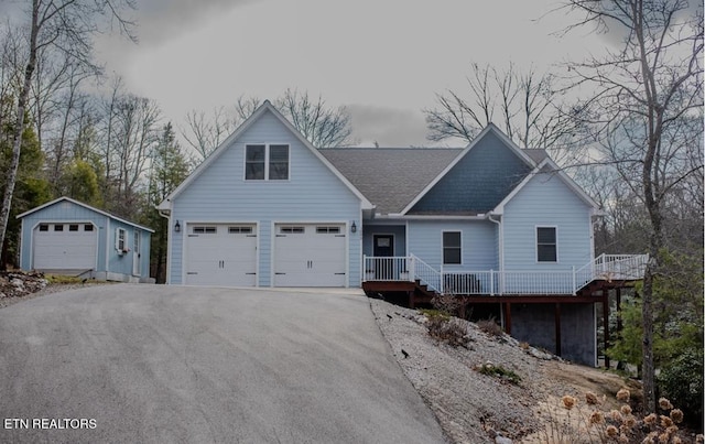 view of front of house with an outbuilding and a garage