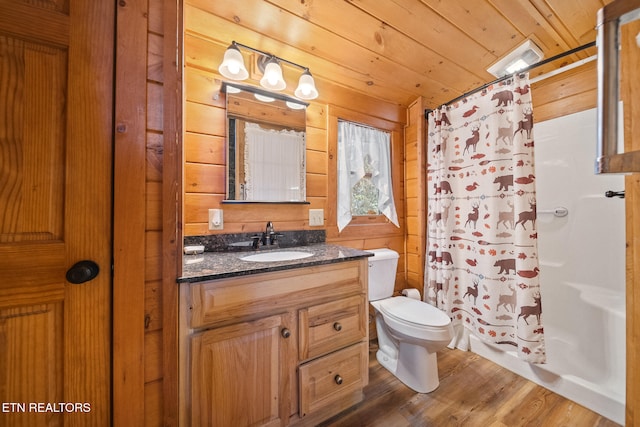 bathroom featuring hardwood / wood-style floors, vanity, wooden ceiling, a shower with shower curtain, and toilet