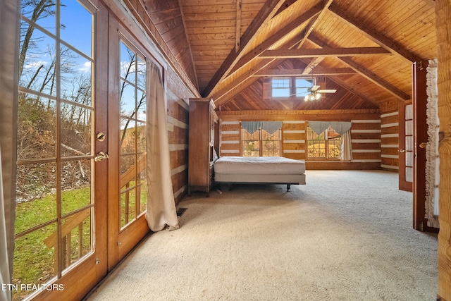 unfurnished bedroom with carpet, vaulted ceiling with beams, and wood ceiling