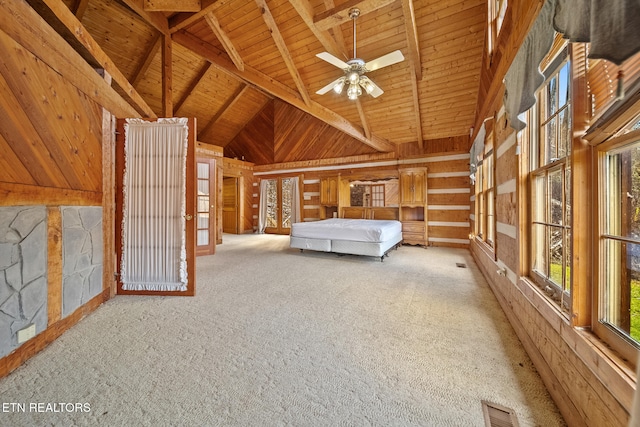 unfurnished bedroom featuring lofted ceiling with beams, light carpet, and wooden ceiling