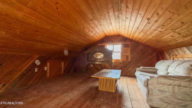 bonus room with wood-type flooring, wooden ceiling, vaulted ceiling, and wooden walls