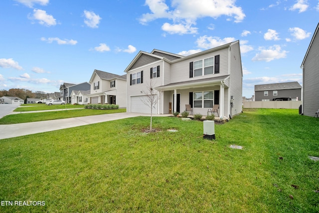 view of front of home featuring covered porch, a garage, and a front yard