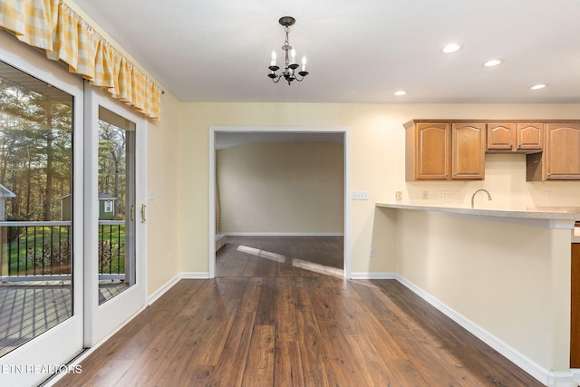 122 Windsor Rd, Crossville, TN 38558 - kitchen featuring dark hardwood / wood-style floors, sink, decorative light fixtures, and a chandelier