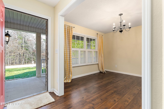 122 Windsor Rd, Crossville, TN 38558 - foyer featuring dark wood-type flooring and a notable chandelier