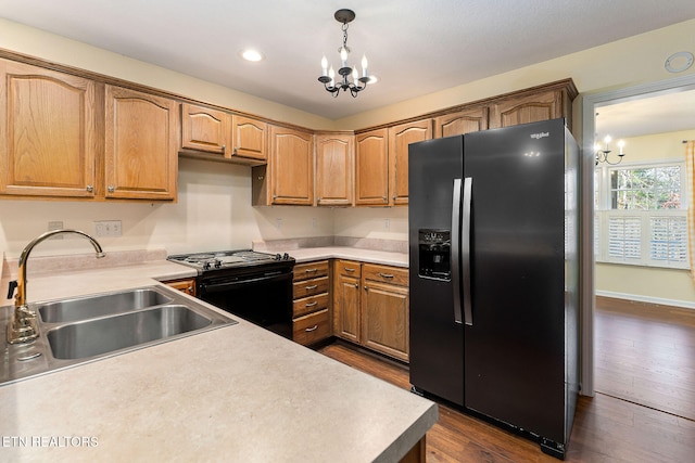 122 Windsor Rd, Crossville, TN 38558 - kitchen with black stove, sink, hanging light fixtures, an inviting chandelier, and stainless steel fridge with ice dispenser