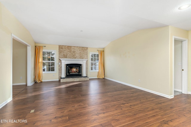 122 Windsor Rd, Crossville, TN 38558 - unfurnished living room featuring a large fireplace, dark wood-type flooring, and vaulted ceiling
