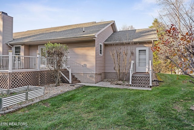 122 Windsor Rd, Crossville, TN 38558 - back of house with a lawn and a wooden deck