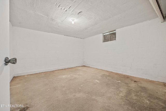 spare room with concrete floors