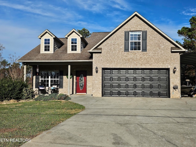 view of property featuring a garage and a front yard