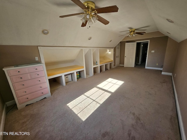 bonus room with ceiling fan, light carpet, and lofted ceiling