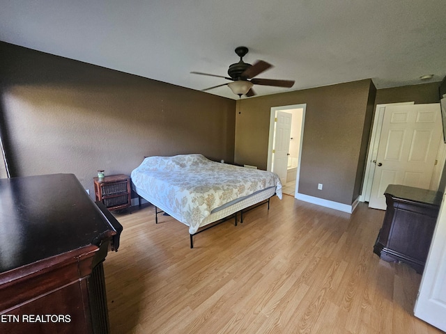 bedroom with light wood-type flooring and ceiling fan