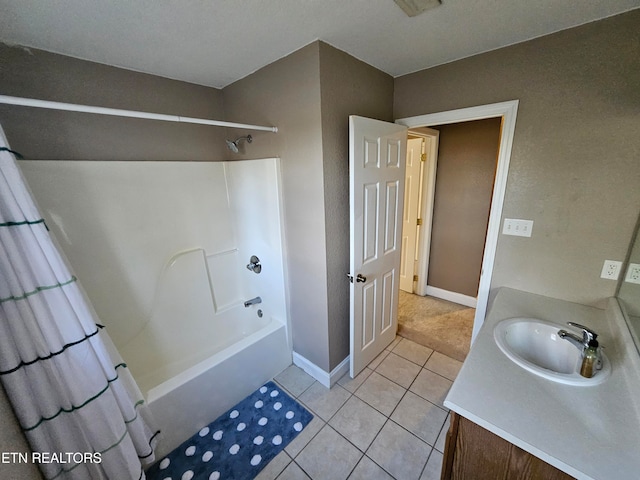 bathroom with vanity, tile patterned floors, and shower / bath combo with shower curtain