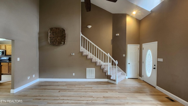 630 Chris Haven Dr, Seymour, TN 37865 - entrance foyer with high vaulted ceiling, stairs, light wood-style floors, ceiling fan, and baseboards