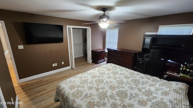 630 Chris Haven Dr, Seymour, TN 37865 - bedroom featuring light wood-style flooring, a desk, ceiling fan, baseboards, and a closet