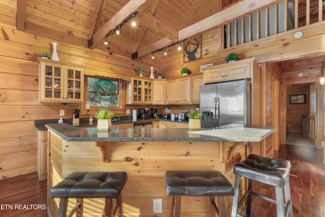 kitchen with stainless steel fridge with ice dispenser, beamed ceiling, high vaulted ceiling, track lighting, and wood ceiling