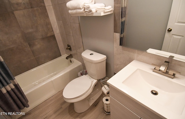 full bathroom featuring wood-type flooring, vanity, toilet, and shower / bath combo