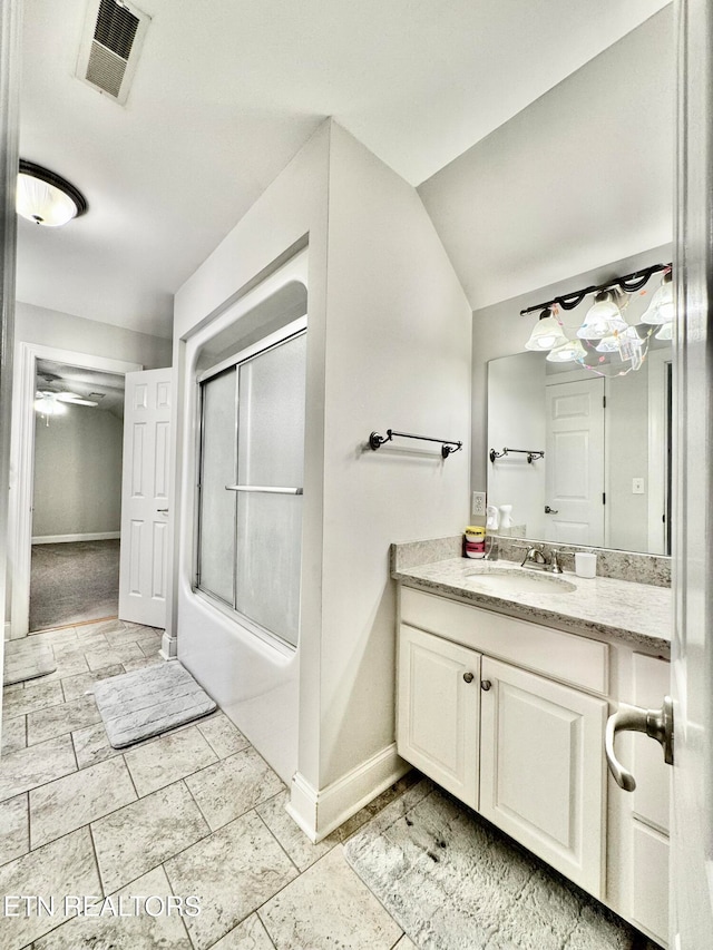 bathroom with vanity, ceiling fan, shower / bath combination with glass door, and vaulted ceiling