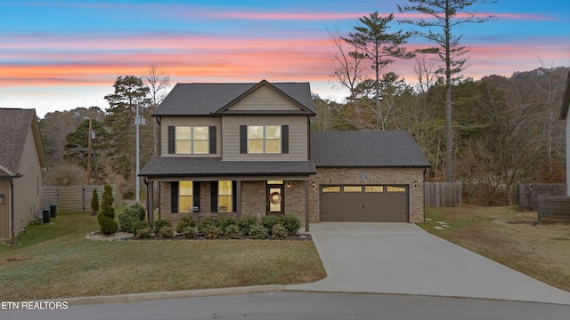 view of front of house with a lawn and a garage