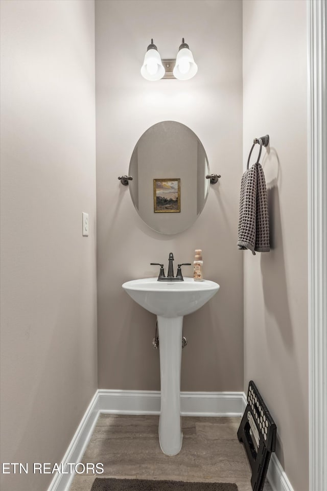 bathroom with wood-type flooring