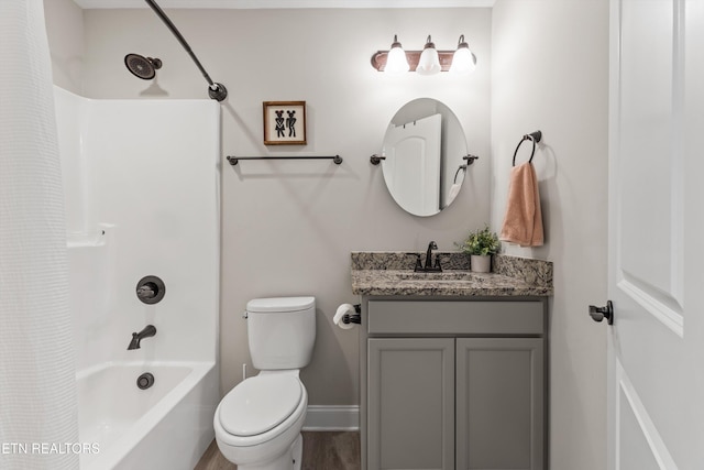 full bathroom with shower / bath combo with shower curtain, vanity, hardwood / wood-style floors, and toilet