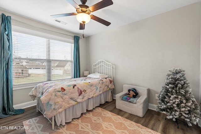 bedroom featuring ceiling fan and dark hardwood / wood-style floors