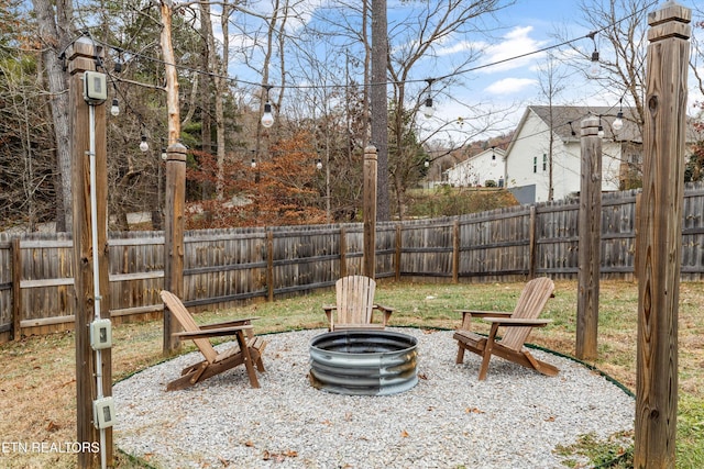 view of yard with a fire pit