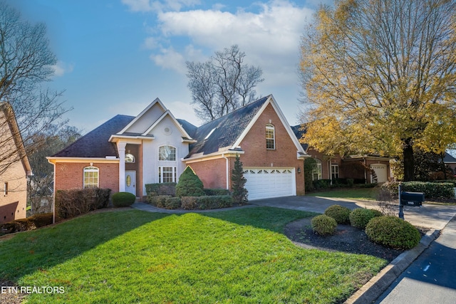 view of front of home featuring a garage and a front yard