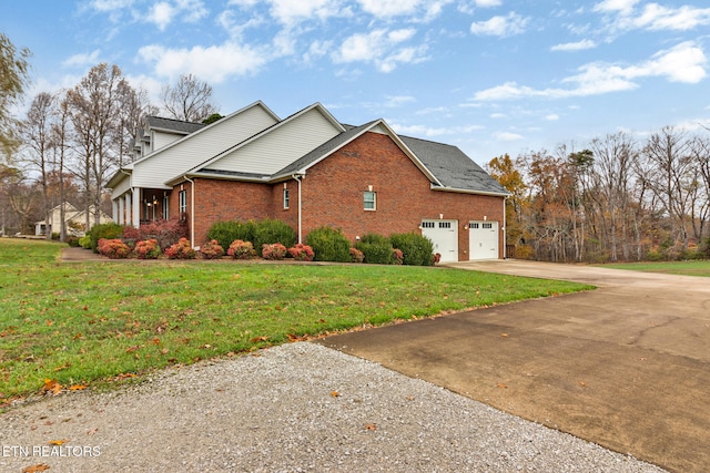 view of home's exterior with a garage and a lawn