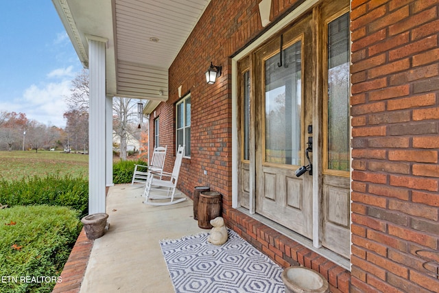 doorway to property featuring covered porch