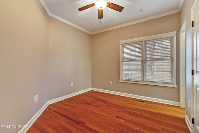 unfurnished room with ceiling fan, wood-type flooring, and ornamental molding