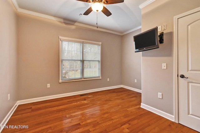 unfurnished room featuring wood-type flooring, ceiling fan, and ornamental molding