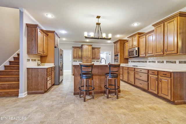 kitchen featuring a center island with sink, a kitchen breakfast bar, hanging light fixtures, decorative backsplash, and stainless steel appliances