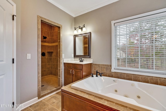 bathroom featuring plus walk in shower, vanity, tile patterned floors, and crown molding