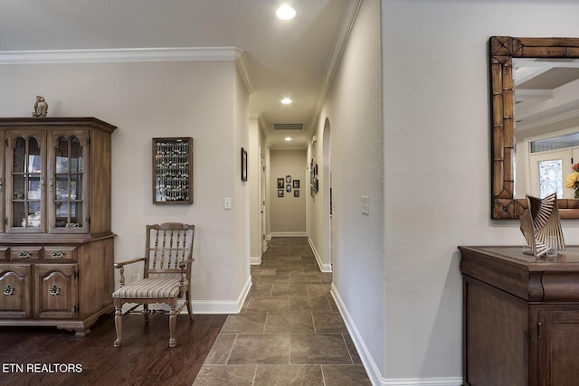 hallway featuring crown molding