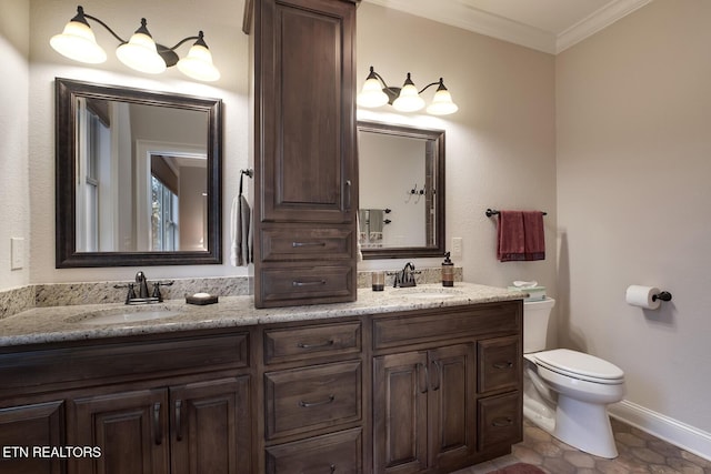 bathroom with crown molding, vanity, tile patterned floors, and toilet