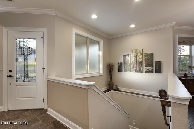 tiled foyer with ornamental molding