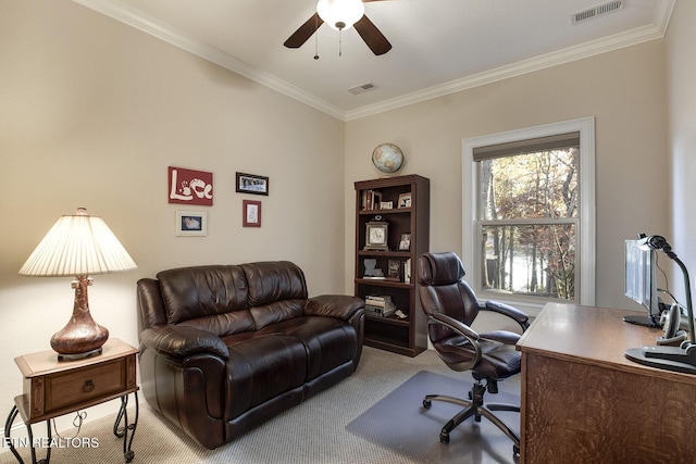 home office featuring crown molding, carpet floors, and ceiling fan