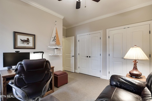 home office featuring crown molding, ceiling fan, and carpet flooring