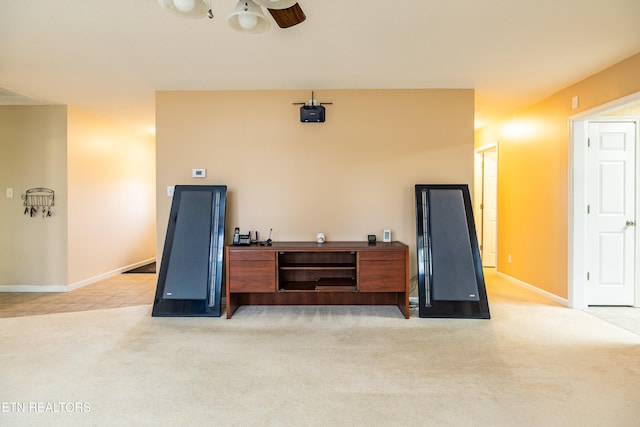 interior space with light colored carpet and ceiling fan