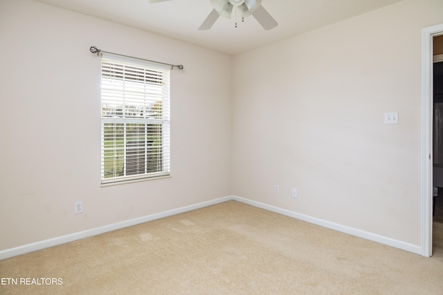 empty room with light carpet and ceiling fan