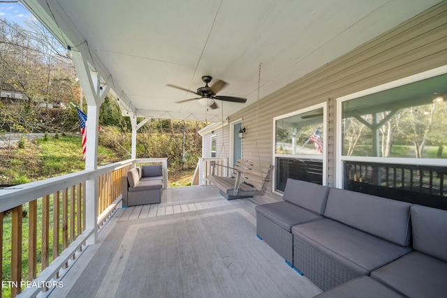 wooden deck featuring ceiling fan