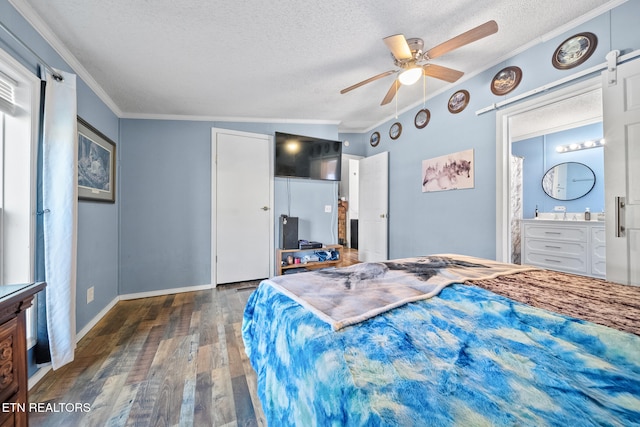 bedroom with a textured ceiling, ceiling fan, dark wood-type flooring, connected bathroom, and lofted ceiling