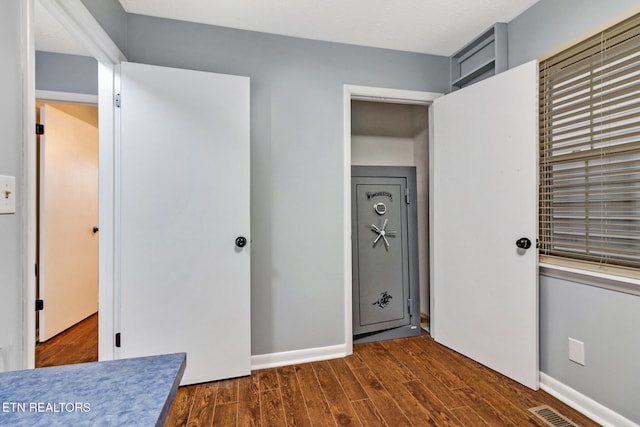 bedroom featuring dark hardwood / wood-style floors