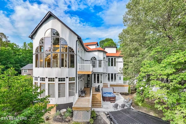 rear view of property featuring a patio