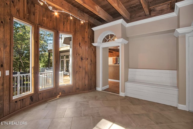 interior space featuring beamed ceiling and wooden ceiling