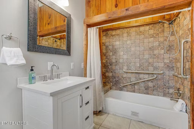 bathroom with tile patterned floors, vanity, and shower / bath combo